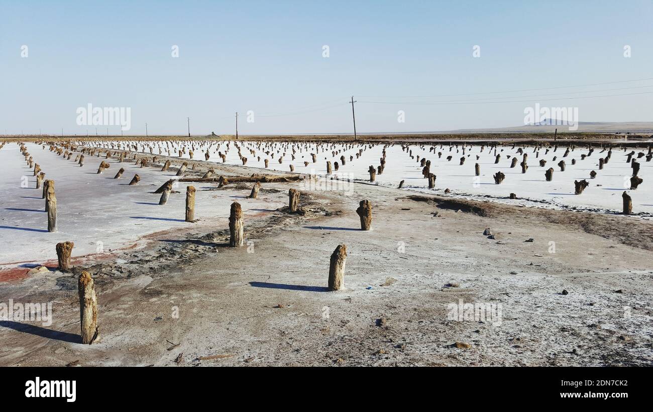 Scenic View Of Salty Lake Against Clear Sky During Winter Stock Photo