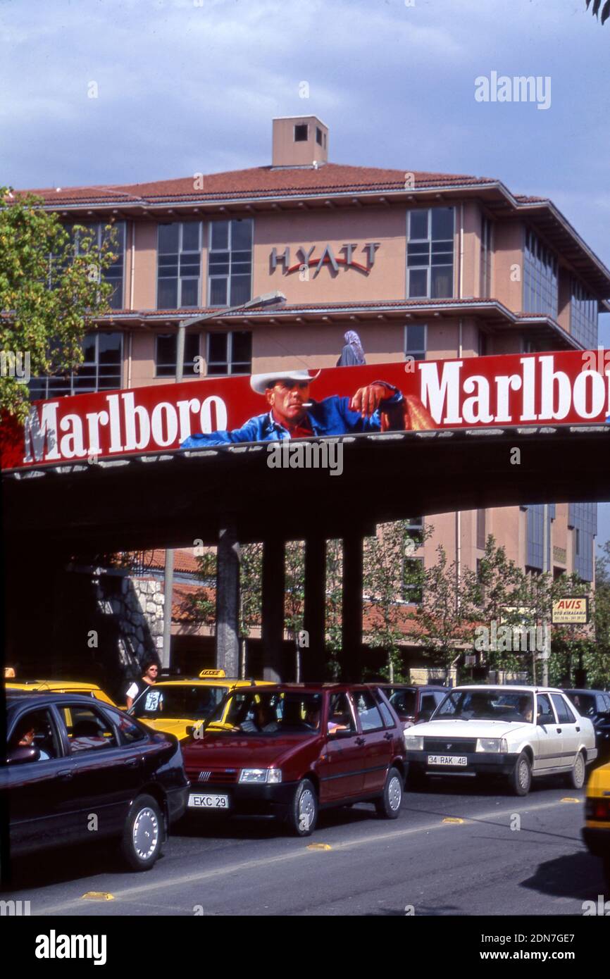 A Marlboro Cigarettes billboard on overpass in front of a Hyatt Hotel in Istanbul, Turkey Stock Photo