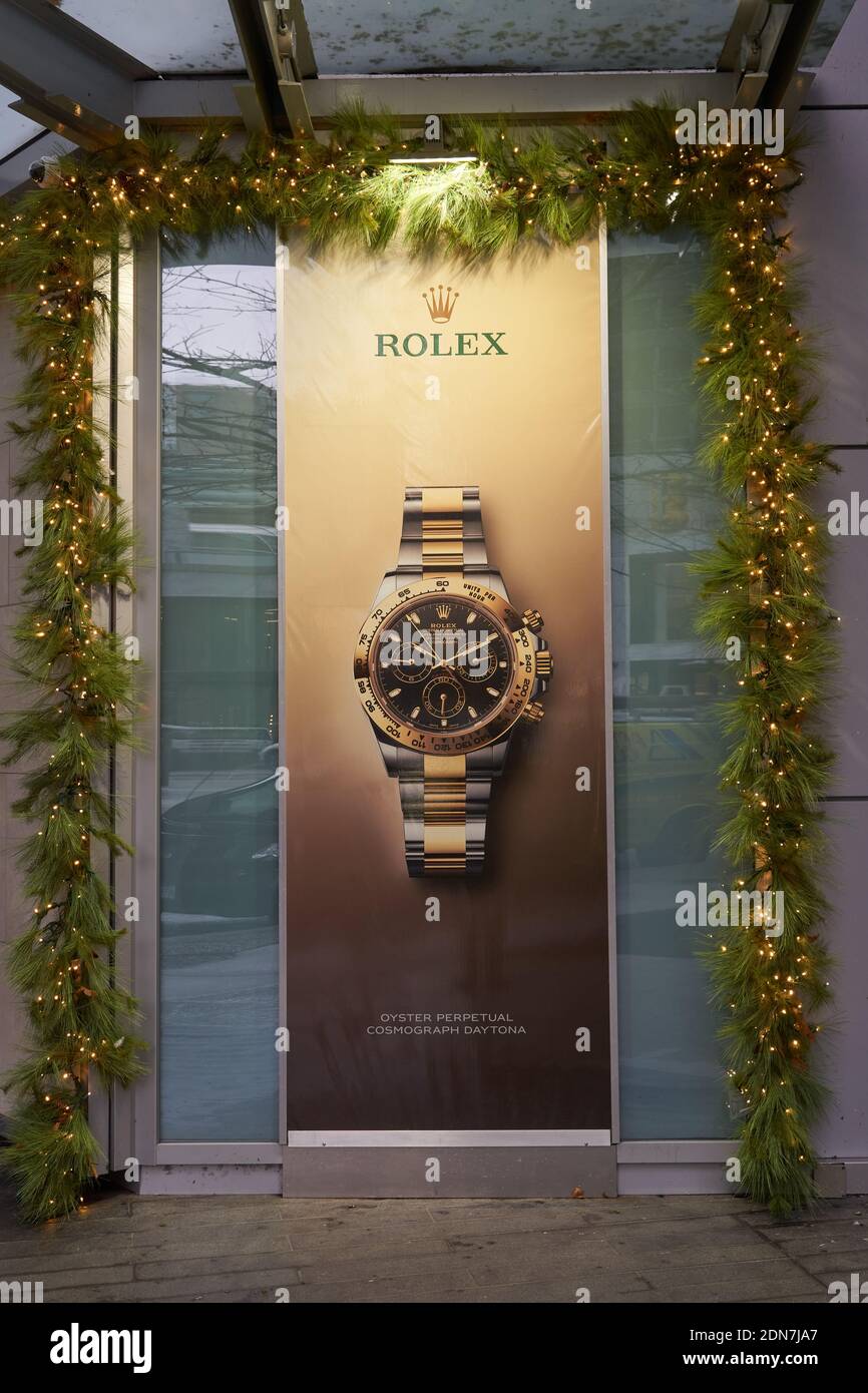 Rolex watch advertisement and Christmas decorations in downtown Vancouver, British Columbia, Canada Stock Photo