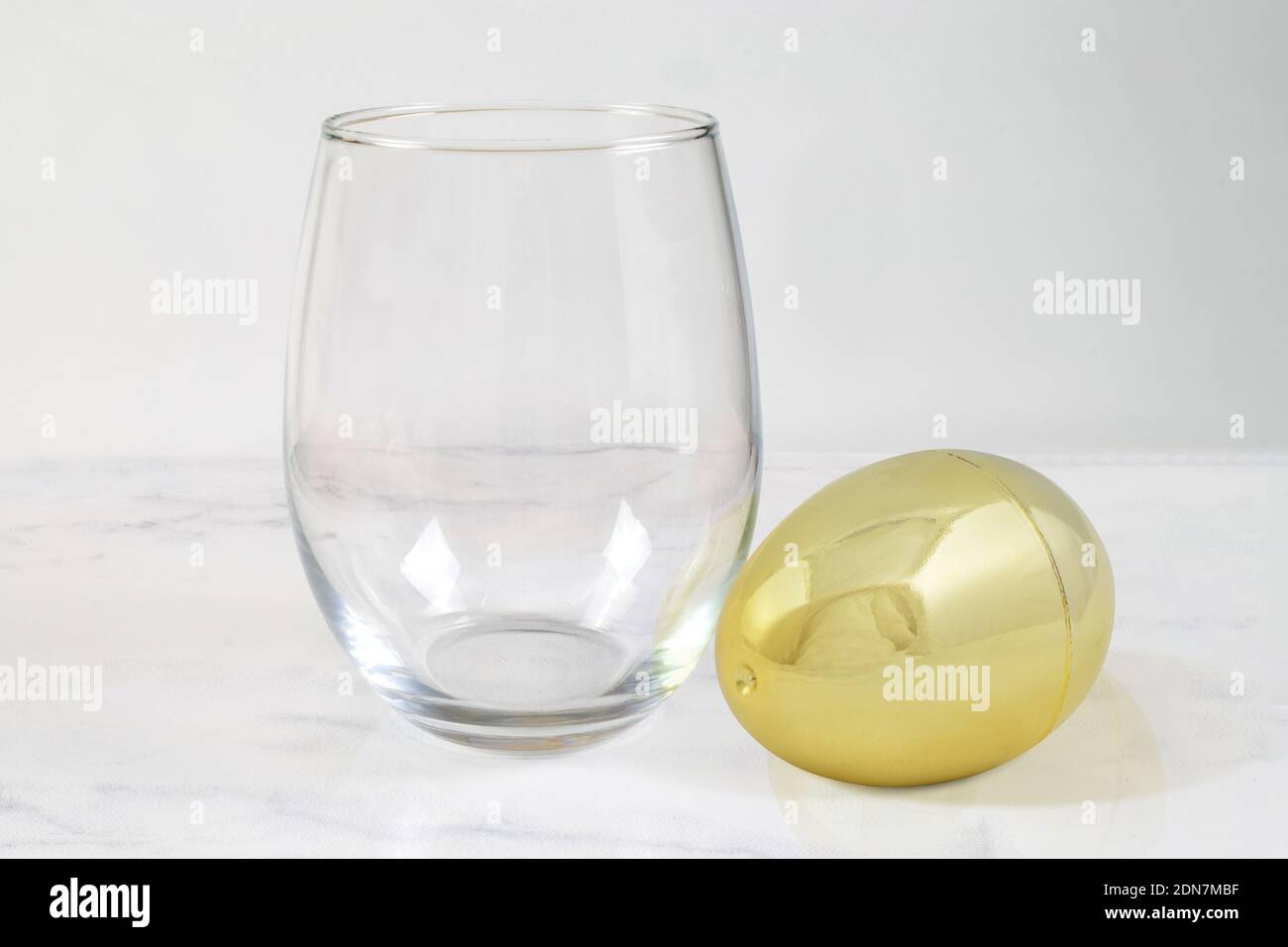 Download Stemless Wine Glass Mockup With Golden Egg Stock Photo Alamy