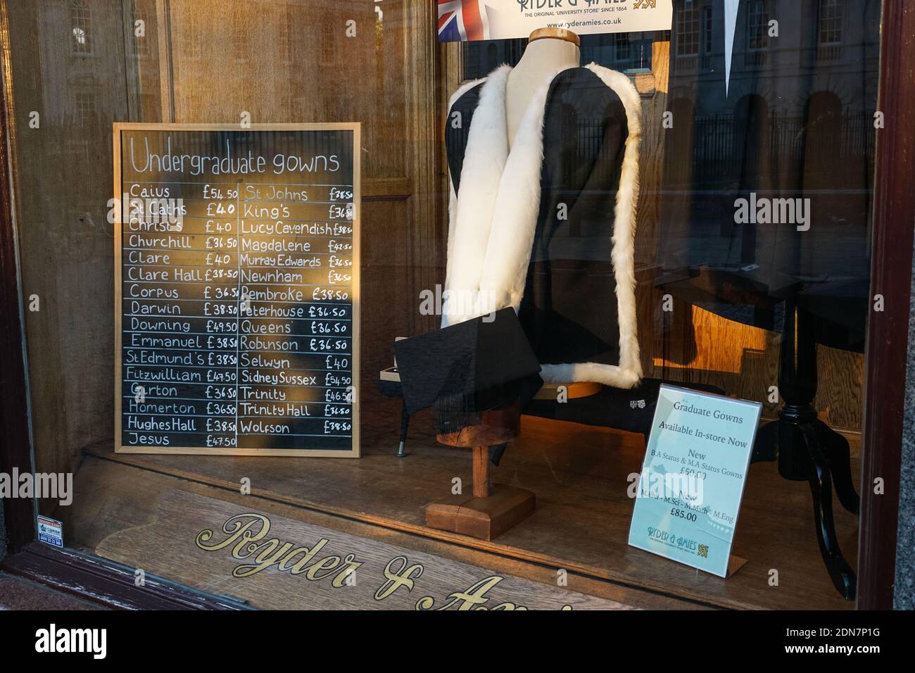 Prices of academic gowns at Ryder & Amies shop on King's Parade in Cambridge, Cambridgeshire England United Kingdom UK Stock Photo