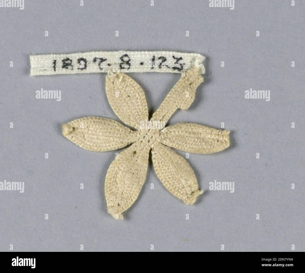 Fragment, Medium: linen Technique: needle lace, Fragment of a tiny flower with five petals and stem., Italy, 16th–17th century, lace, Fragment Stock Photo