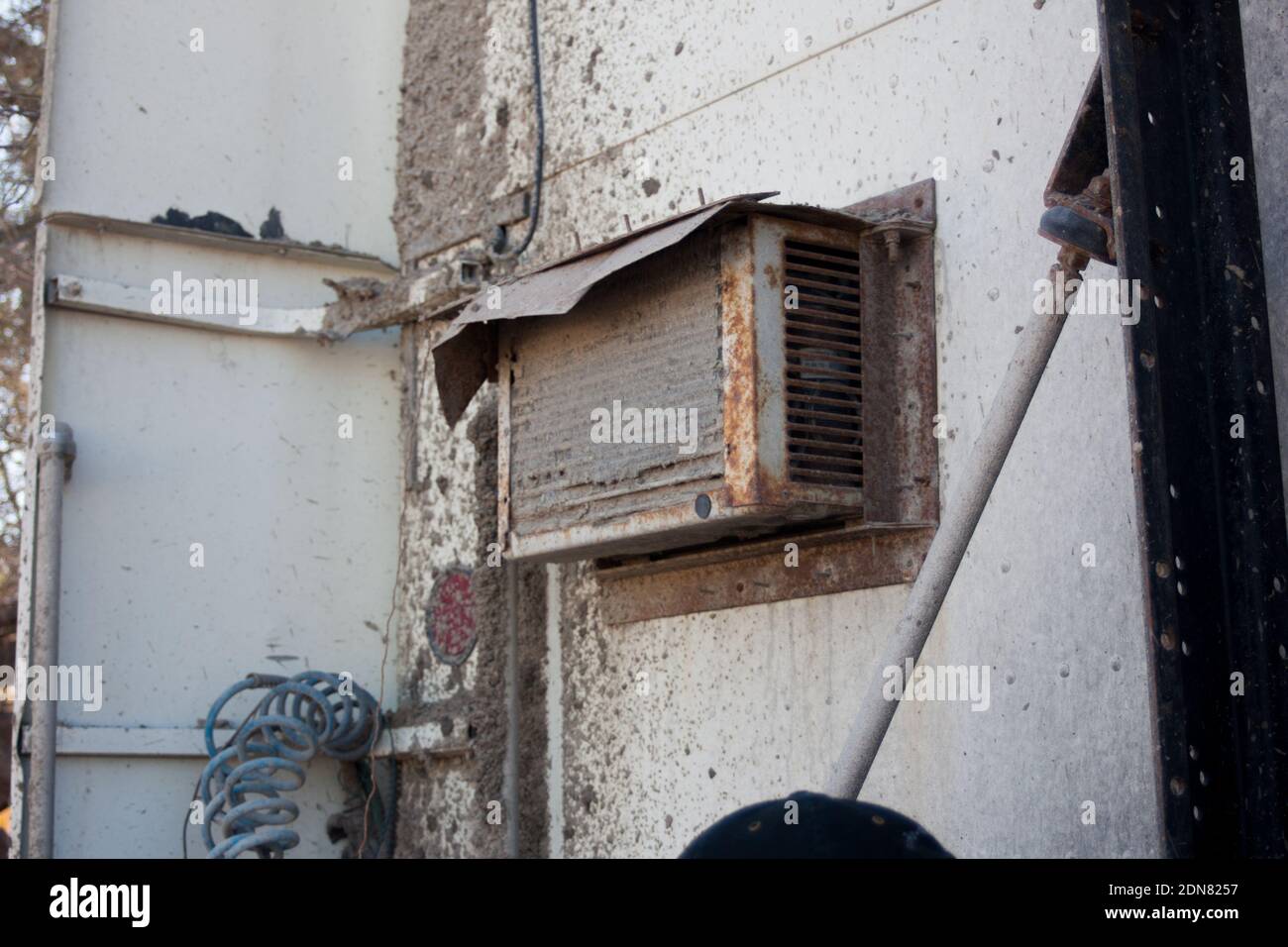 An old rusty air conditioner hanging on a wall Stock Photo Alamy