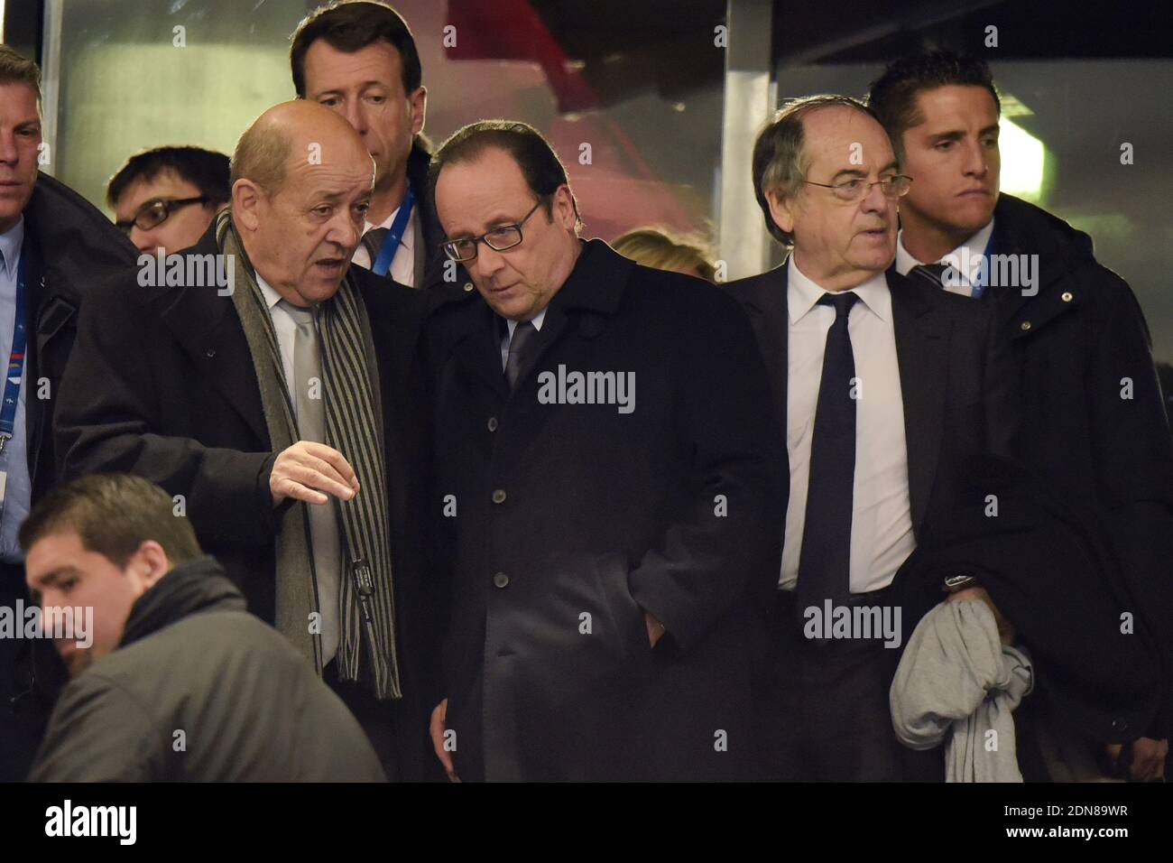 Defense Minister Jean-Yves Le Drian, President Francois Hollande and Noel Le Graet watch from the stands the friendly international football match, France v Brazil at the Stade de France in Saint-Denis near Paris, France, on March 26, 2015. Brazil won 3-1. Photo by Laurent Zabulon/ABACAPRESS.COM? Stock Photo