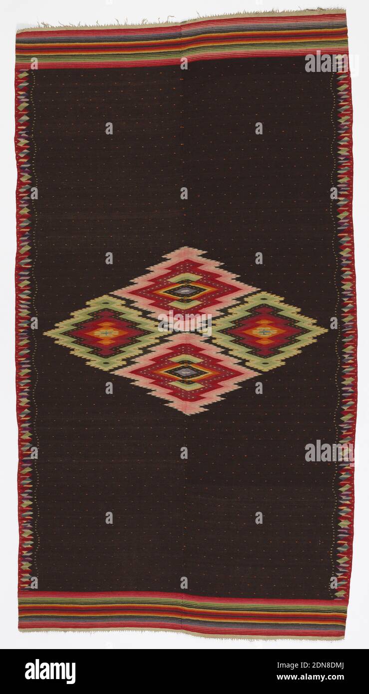 Saltillo serape, Medium: two-ply machine spun undyed cotton (warp); handspun undyed wool (brown and white), handspun indigo-dyed wool, handspun synthetic-dyed wool (weft) Technique: weft-faced dovetail tapestry weave, Late Classic Saltillo serape with a brown field and a central aggregate diamond. Brown field has a repeating red dot pattern with a white wavy dot stripe on either side. Warp ends have multicolored stripes and short off-white fringe. Side borders are stacked, variegated rhombuses in red, purple, yellow-green, dark blue, and light blue., northern Mexico, ca. 1880, woven textiles Stock Photo