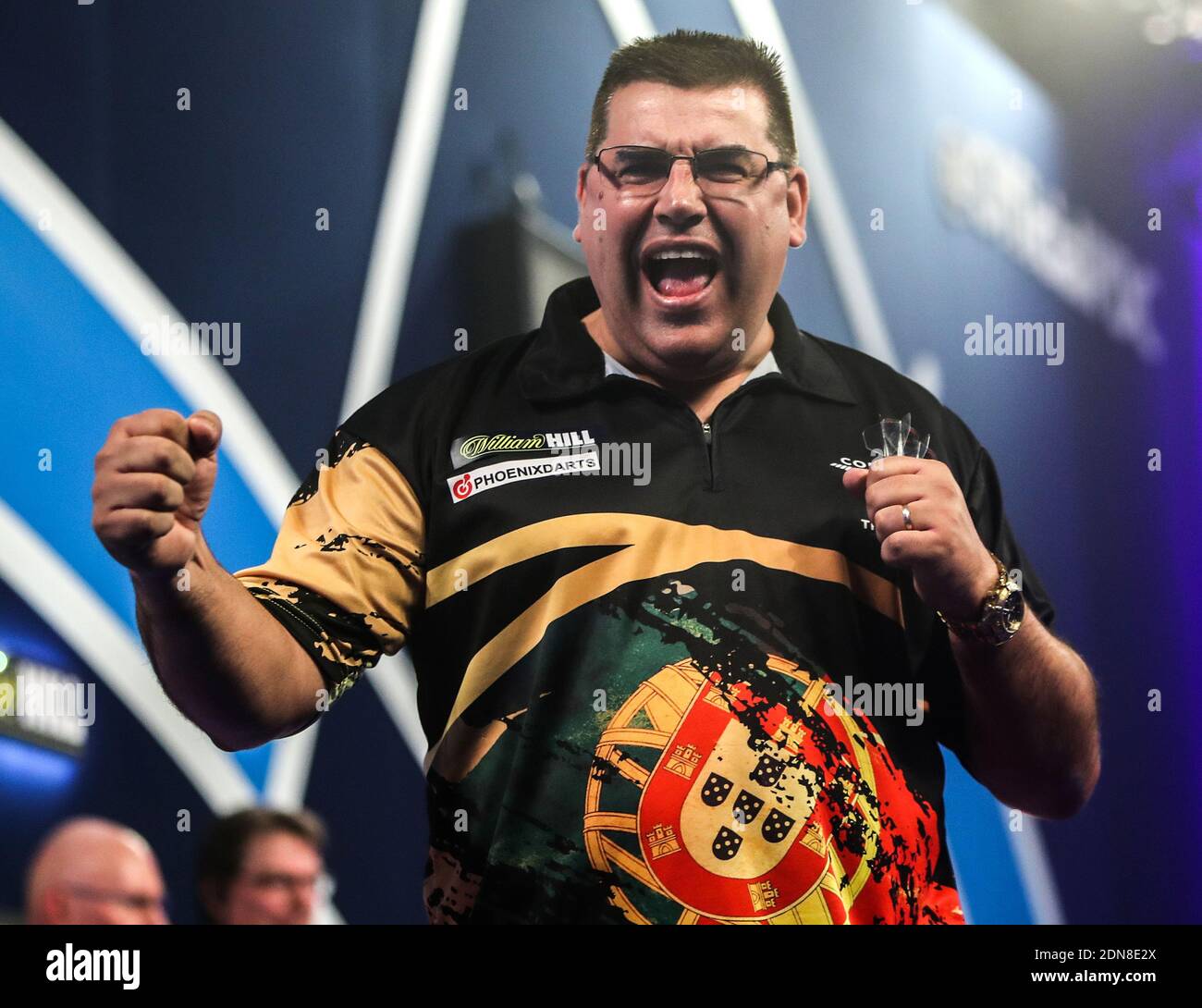 Jose de Sousa celebrates after winning his match during day three of the William Hill World