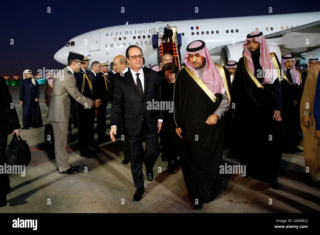 French President Francois Hollande (C-L) is welcomed by the Governor of the Riyadh Province, Turki bin Abdullah al-Saud (C-R) upon his arrival at Riyadh airport on January 24, 2015. World leaders headed to Saudi Arabia on January 24 to offer condolences following the death of King Abdullah. Photo Pool by Yoan Valat/ABACAPRESS.COM Stock Photo