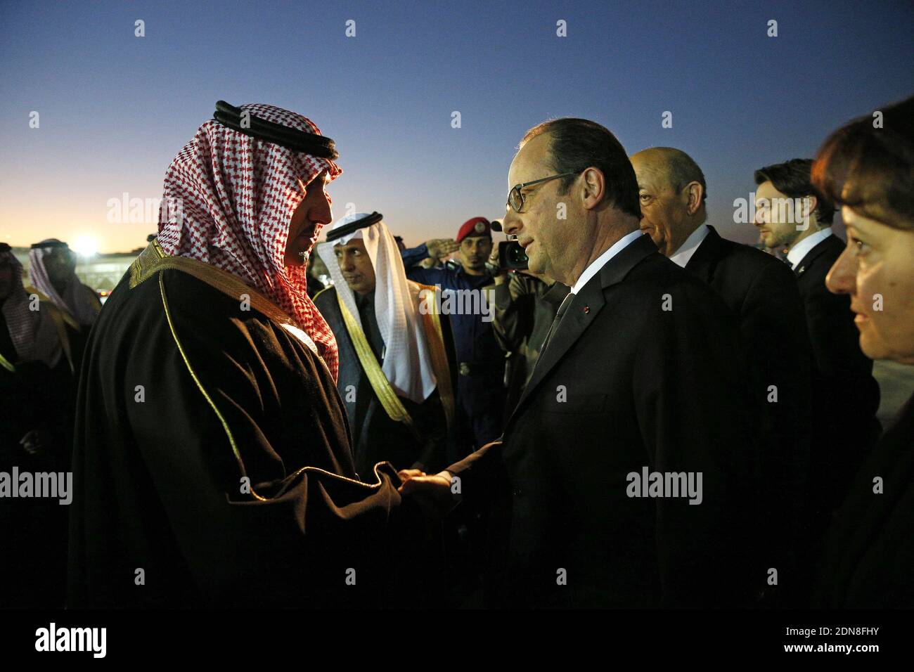 French President Francois Hollande (R) is welcomed by the Governor of the Riyadh Province, Turki bin Abdullah al-Saud (L) upon his arrival at Riyadh airport on January 24, 2015. World leaders headed to Saudi Arabia on January 24 to offer condolences following the death of King Abdullah. Photo Pool by Yoan Valat/ABACAPRESS.COM Stock Photo