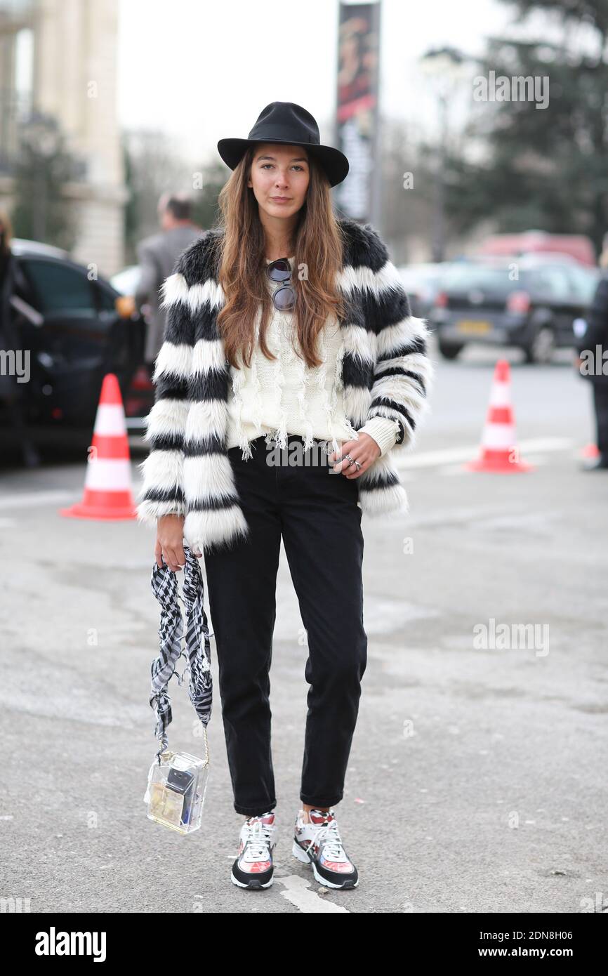 Street style, Estelle Pigault (personal stylist) arriving at Chanel  Spring-Summer 2015 Haute Couture collection show held at Le Grand Palais in  Paris, France, on January 27th, 2015. She is wearing Bershaka faux-fur