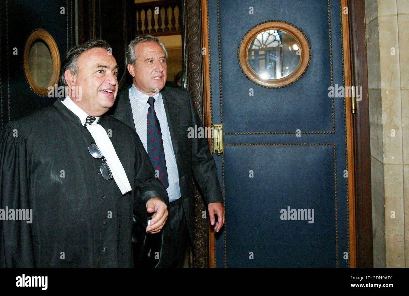 French prefect and former European Parlement member Jean-Charles Marchiani (R), former right-hand man of the French government for secret missions, arrives with his lawyer, Maitre Jacques Tremolet de Villers, to the magistrates' court in Paris, France, on October 3, 2005, for the first day of his trial. Marchiani, 62, appears for influence peddling in a 1.25 million euro contract signed in the 90's between the French weapon company Giat Industries and the German company Renk. He incurs a ten-year prison sentence and a 150,000 euro fine. Photo by Mehdi Taamallah/ABACAPRESS.COM Stock Photo