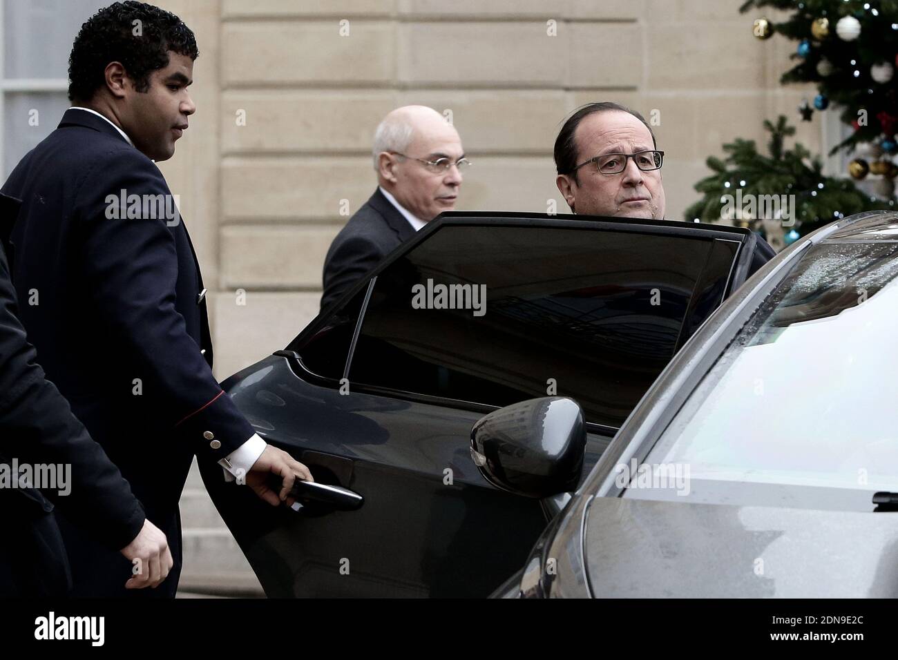 French President Francois Hollande is seen next to Thierry Lataste as he leaves the Elysee Palace and heads to the shooting scene at the Paris offices of satirical weekly Charlie Hebdo, in Paris, France on January 7, 2015. At least 12 people were killed - including two police officers - and 5 injured when two heavily armed gunmen stormed the offices. The magazine is most famous internationally for publishing a controversial series of cartoons depicting the Prophet Mohammed in 2012. Photo by Stephane Lemouton/ABACAPRESS.COM Stock Photo