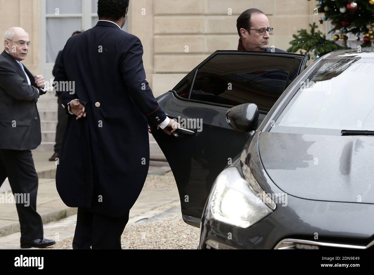 French President Francois Hollande is seen next to Thierry Lataste leaving the Elysee Palace and heading to the shooting scene at the Paris offices of satirical weekly Charlie Hebdo, in Paris, France on January 7, 2015. At least 12 people were killed - including two police officers - and 5 injured when two heavily armed gunmen stormed the offices. The magazine is most famous internationally for publishing a controversial series of cartoons depicting the Prophet Mohammed in 2012. Photo by Stephane Lemouton/ABACAPRESS.COM Stock Photo