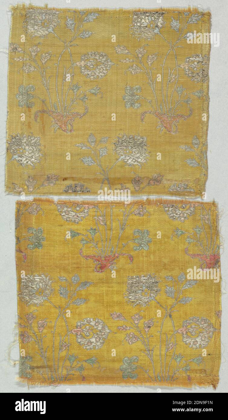 Fragment, Medium: silk, metallic Technique: woven, Yellow ground with repeat of ornamental flowers on slender stems growing in shell-shaped vessel. Repeat in green, blue, rose, and gray silk extra weft and silver metallic brocade., Iran, 19th century, woven textiles, Fragment Stock Photo