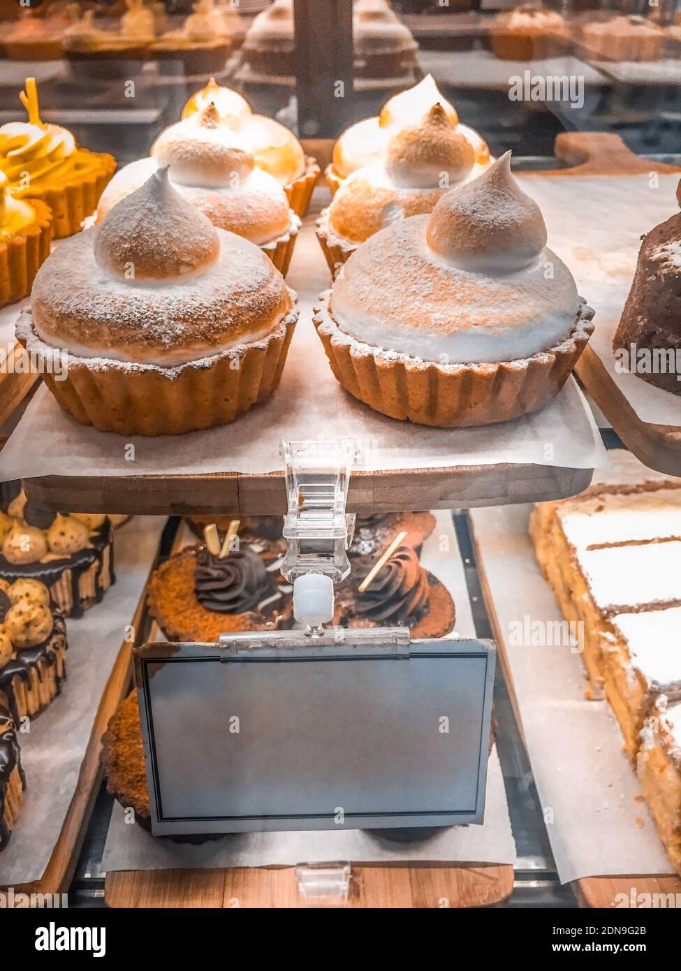 Close-up Of Dessert In Display Cabinet At Store Stock Photo