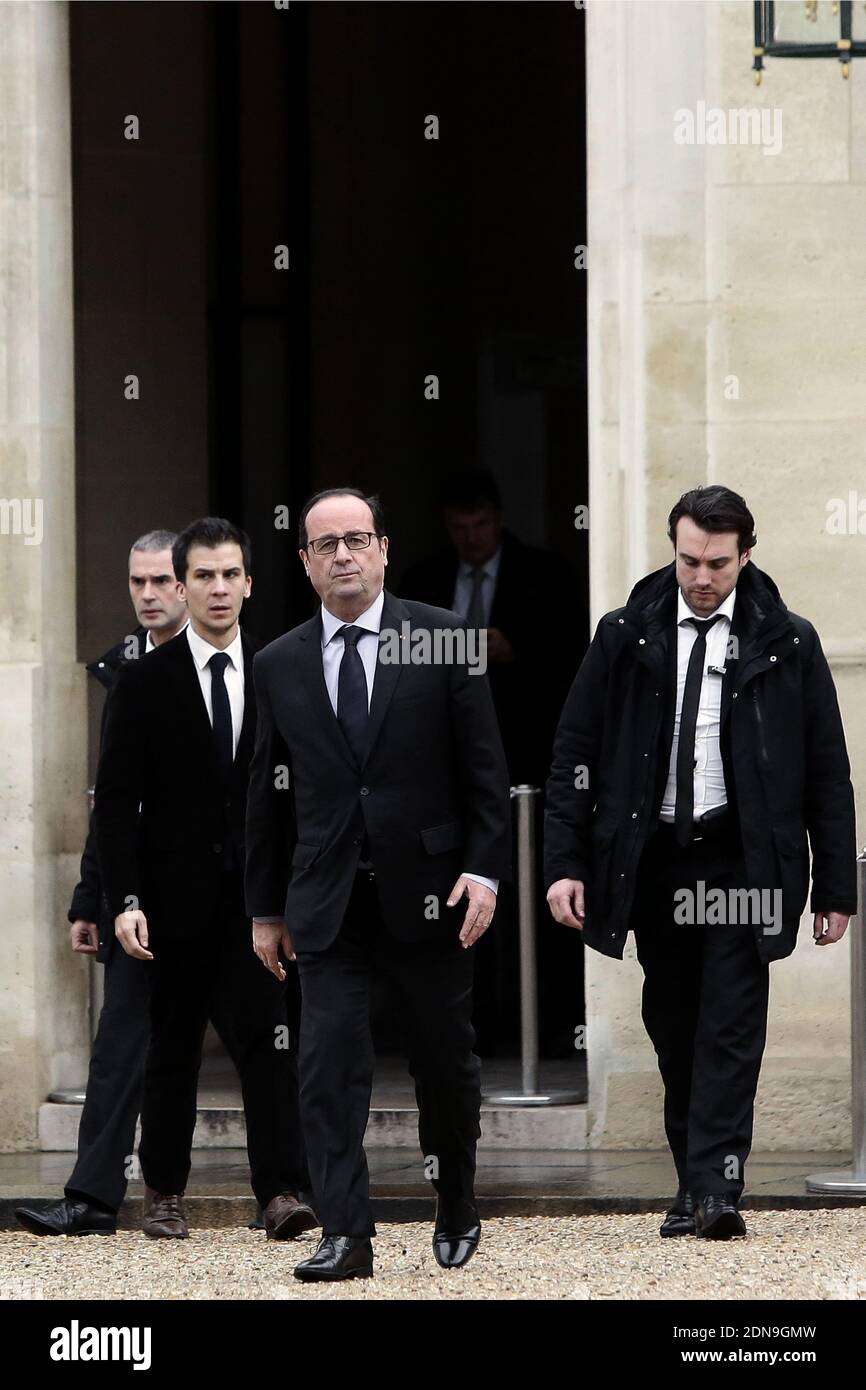 French President Francois Hollande flanked Thierry Lataste and Gaspard Gantzner comes back to the presidential Elysee palace after a crisis meeting with French prefects at the Interior Ministry on January 9, 2015 in Paris, France. Two days after a deadly attack that occurred on January 7 by armed gunmen on the Paris offices of French satirical weekly newspaper Charlie Hebdo. France deployed elite forces in the hunt for two brothers accused of killing 12 people in the attack, as the pair spent a second night on the run despite a huge security operation. Photo by Stephane Lemouton/ABACAPRESS.COM Stock Photo