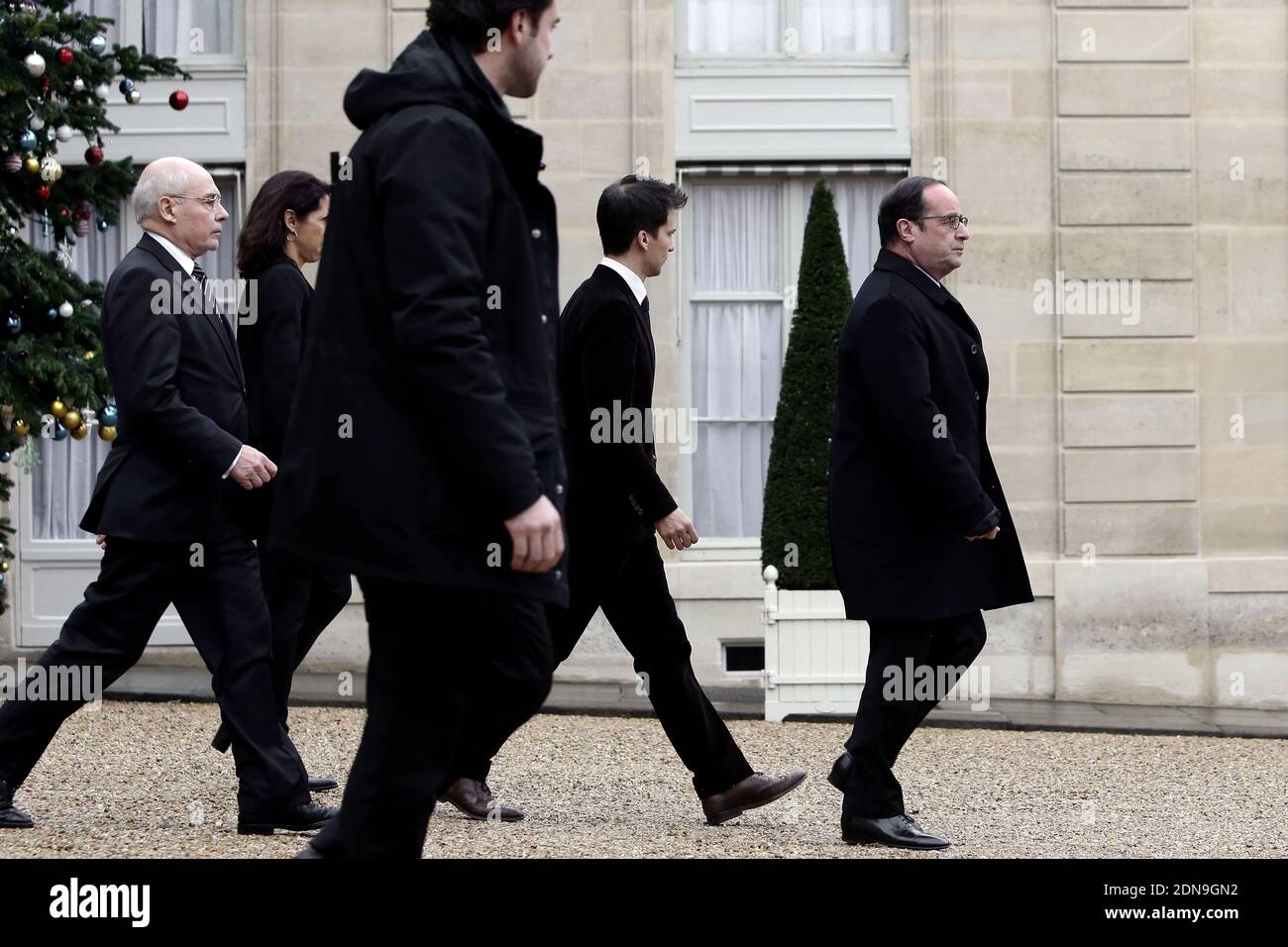 French President Francois Hollande flanked Thierry Lataste and Gaspard Gantzner leaves the presidential Elysee palace to hold a crisis meeting with French prefects at the Interior Ministry on January 9, 2015 in Paris, France. Two days after a deadly attack that occurred on January 7 by armed gunmen on the Paris offices of French satirical weekly newspaper Charlie Hebdo. France deployed elite forces in the hunt for two brothers accused of killing 12 people in the attack, as the pair spent a second night on the run despite a huge security operation. Photo by Stephane Lemouton/ABACAPRESS.COM Stock Photo