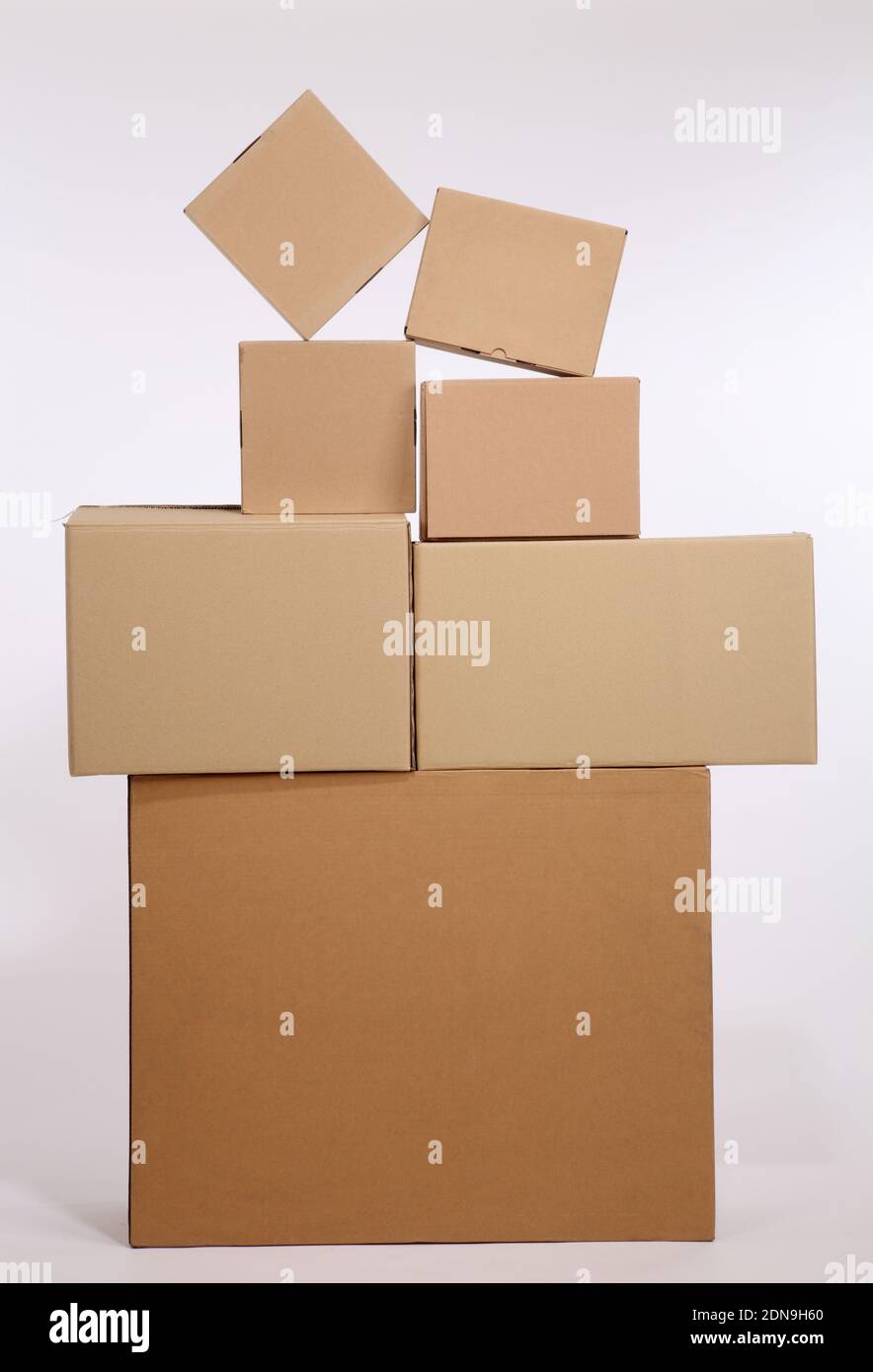 Cardboard Boxes Stacked Against White Background Stock Photo - Alamy