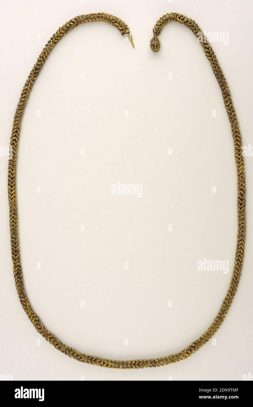 Neck chain, Gilt metal, Neck chain of gilt metal consisting of numerous links of varying widths attached to one another in complicated but repeated pattern., India, 19th century, jewelry, Decorative Arts, Neck chain Stock Photo