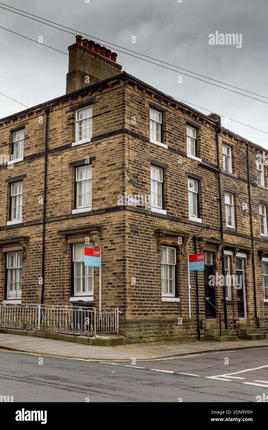 A corner house with a sold sign in Saltaire, Yorkshire, England. Stock Photo