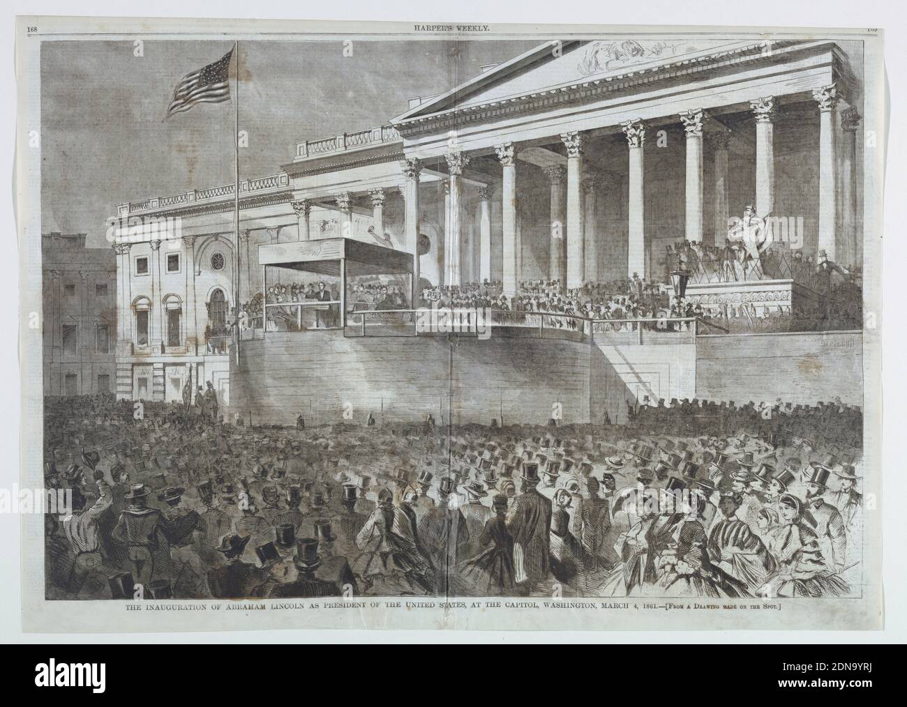 The Inauguration of Abraham Lincoln as President of the United States at the Capitol, Washington, D.C., March 4, 1861, from Harper's Weekly, March 16, 1861, pp. 168-169., Wood engraving in black ink on newsprint paper, Horizontal scene before the Capitol building showing Lincoln addressing the audience from a specially constructed platform in front of the entrance to the Rotunda, with crowds visible in the foreground., November 16, 1861, graphic design, Print Stock Photo