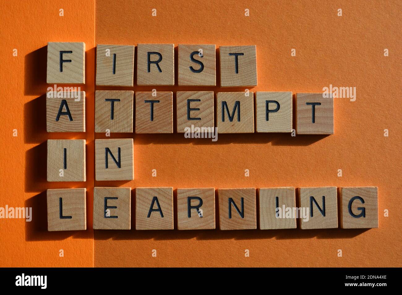 Fail, acronym for First Attempt in Learning, in wooden alphabet letters  isolated on orange background Stock Photo - Alamy