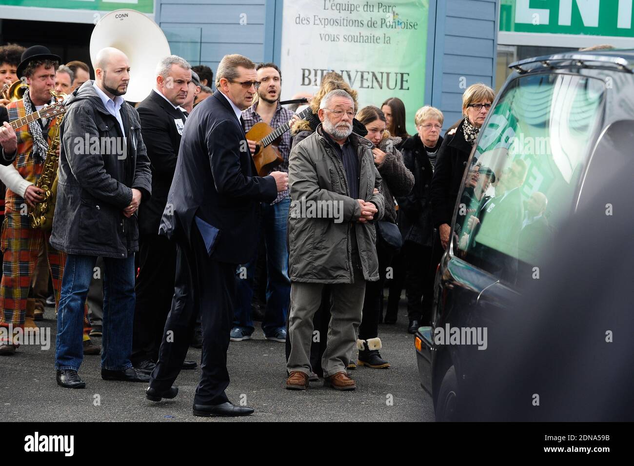 Relatives leaving the funeral of French cartoonist and Charlie Hebdo editor Stephane 'Charb' Charbonnier, on January 16, 2014 in Pontoise, outside Paris. Twelve people were killed, including cartoonists Charb, Wolinski, Cabu and Tignous and deputy chief editor Bernard Maris when gunmen armed with Kalashnikovs and a rocket-launcher opened fire in the Paris offices of Charlie Hebdo on January 7. Photo by ABACAPRESS.COM Stock Photo