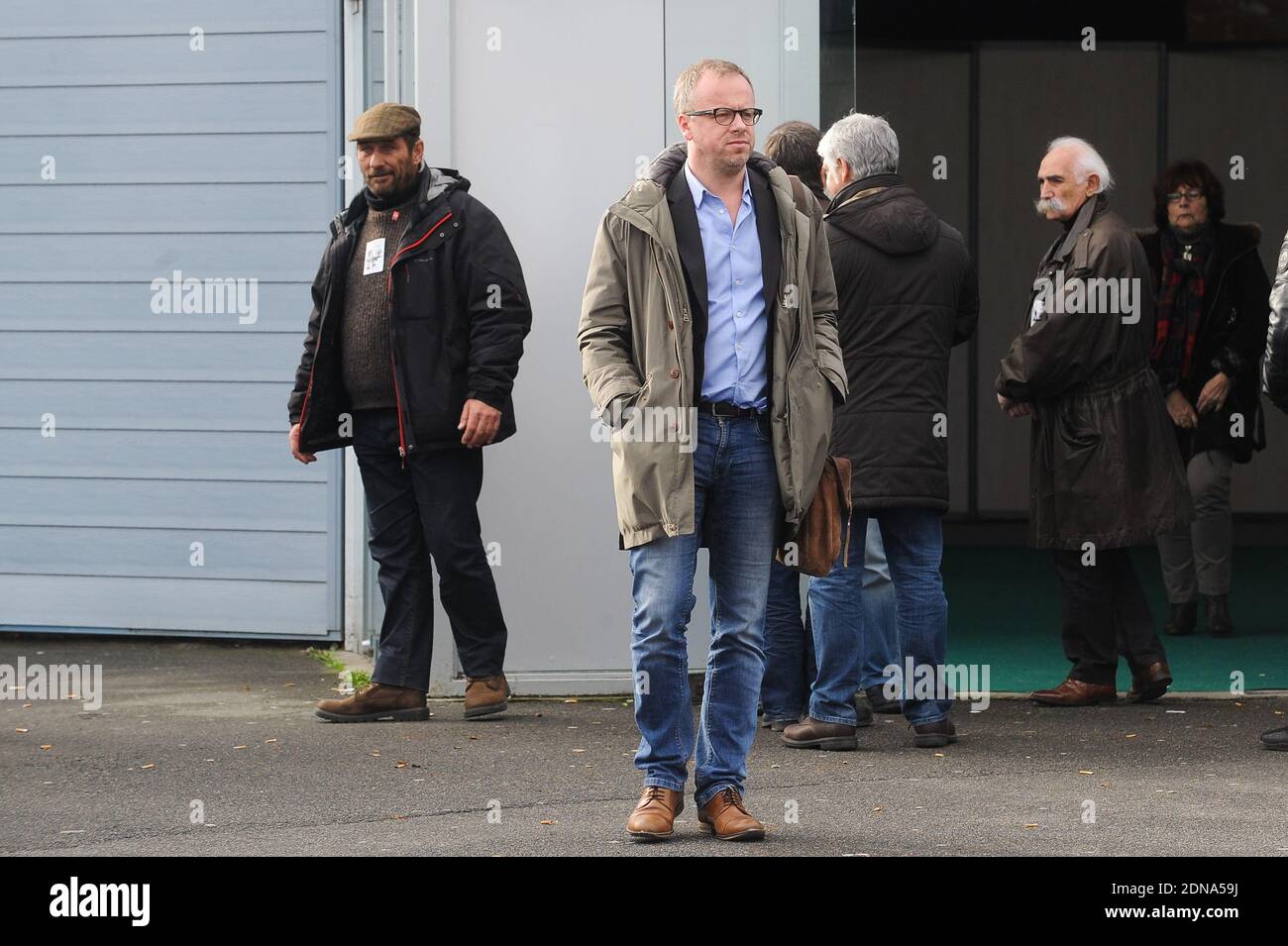 Guest leaving the funeral of French cartoonist and Charlie Hebdo editor Stephane 'Charb' Charbonnier, on January 16, 2014 in Pontoise, outside Paris. Twelve people were killed, including cartoonists Charb, Wolinski, Cabu and Tignous and deputy chief editor Bernard Maris when gunmen armed with Kalashnikovs and a rocket-launcher opened fire in the Paris offices of Charlie Hebdo on January 7. Photo by ABACAPRESS.COM Stock Photo