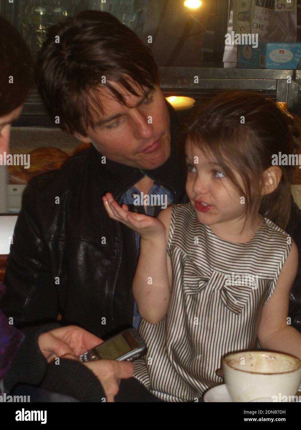 Boston, United States Of America. 07th Nov, 2009. BOSTON, MA - NOVEMBER 07: (EXCLUSIVE COVERAGE) Tom Cruise, daughter Suri, along with son Connor and wife Katie Holmes go out to a small cafe on the west side. The crusie family had a blast as the family enjoyed cafe and cake. Little Suri looked ablsolutely adorable as she played and picked at her dersert. Tom is in Boston filming his new movie 'Wichita' alongside Cameron Diaz. on November 07, 2009 in Boston, Massachusetts People: Tom Cruise, Suri Cruise Credit: Storms Media Group/Alamy Live News Stock Photo