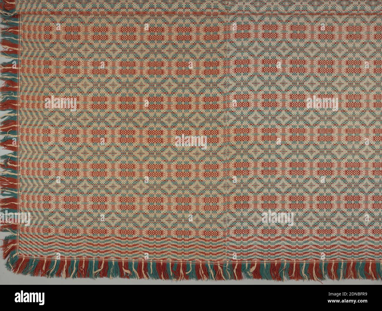 Coverlet, Medium: wool, cotton, Overshot coverlet in rust red, blue-green and tan, made of two lengths stitched together., USA, 1840, woven textiles, Coverlet Stock Photo