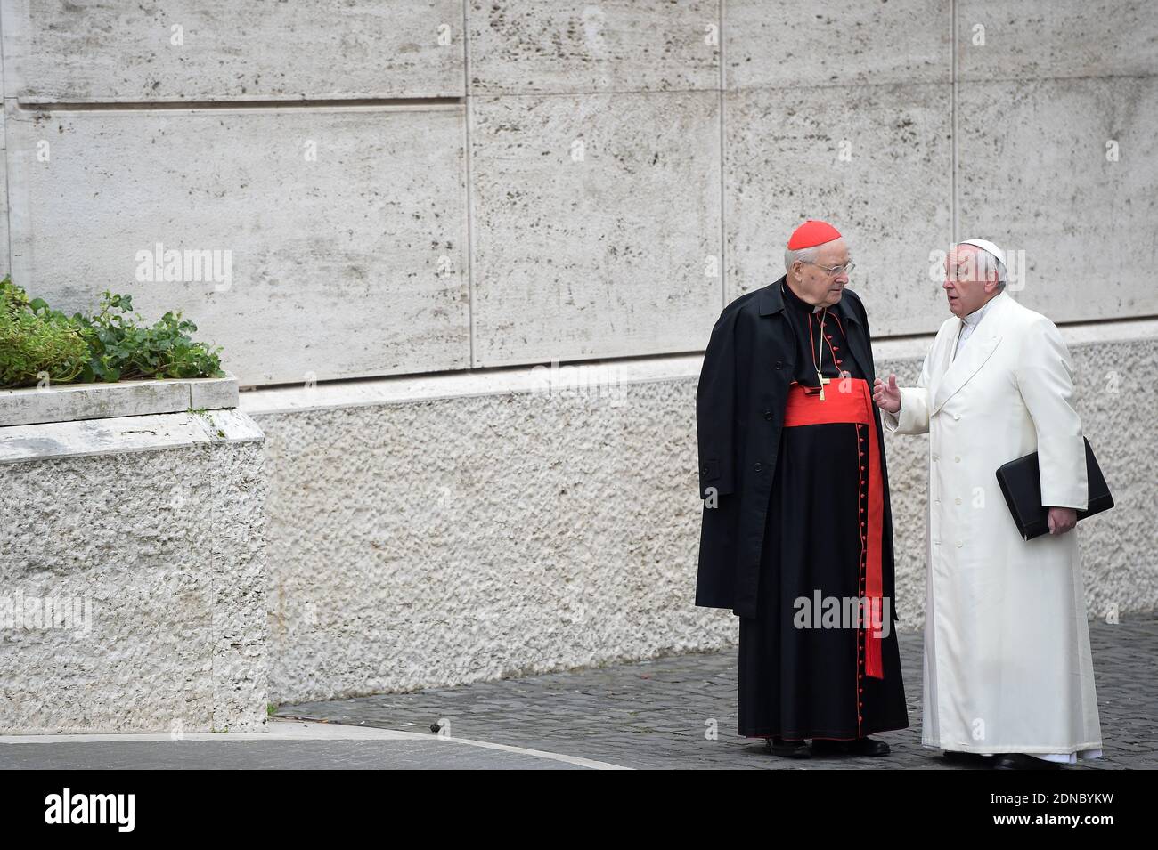 Pope Francis speaks with Italian cardinal Angelo Sodano, as he arrives to take part with cardinals and bishops at the extraordinary consistory before the nominations of new cardinals, at the Vatican on February 13, 2015. Pope Francis is urging his cardinals to cooperate with his reform of the outdated and dysfunctional Vatican bureaucracy. Photo by Eric Vandeville/ ABACAPRESS.COM Stock Photo