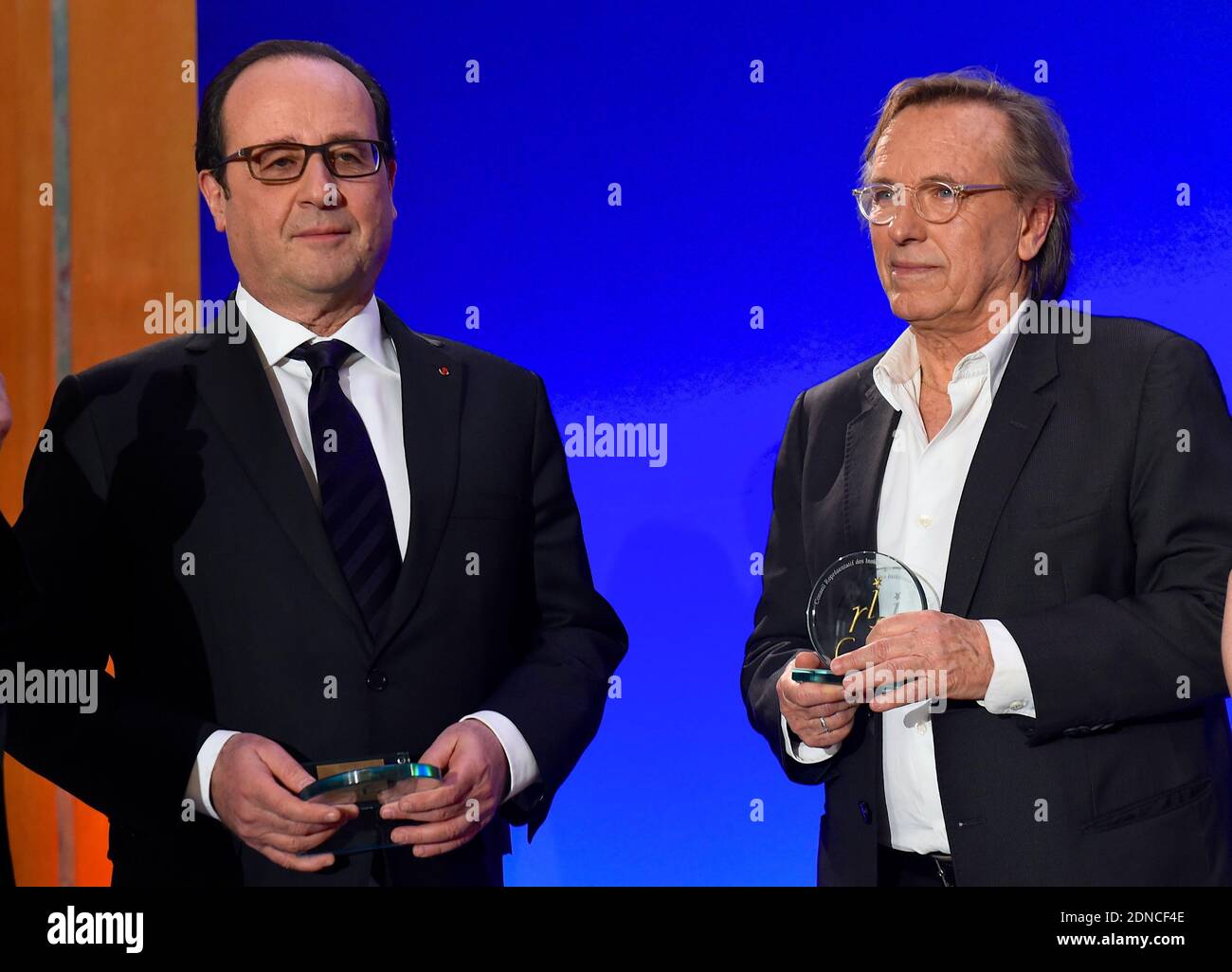 French President Francois Hollande presents director Alexander Arcady with a CRIF award during the 30th annual Dinner of the Representative Council of the Jews of France (CRIF) held at the Pullman Montparnasse Hotel in Paris, France on February 23, 2015. Photo Pool by Erez Lichtfeld/ABACAPRESS.COM Stock Photo