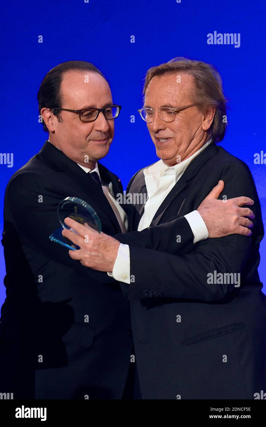 French President Francois Hollande presents director Alexander Arcady with a CRIF award during the 30th annual Dinner of the Representative Council of the Jews of France (CRIF) held at the Pullman Montparnasse Hotel in Paris, France on February 23, 2015. Photo Pool by Erez Lichtfeld/ABACAPRESS.COM Stock Photo