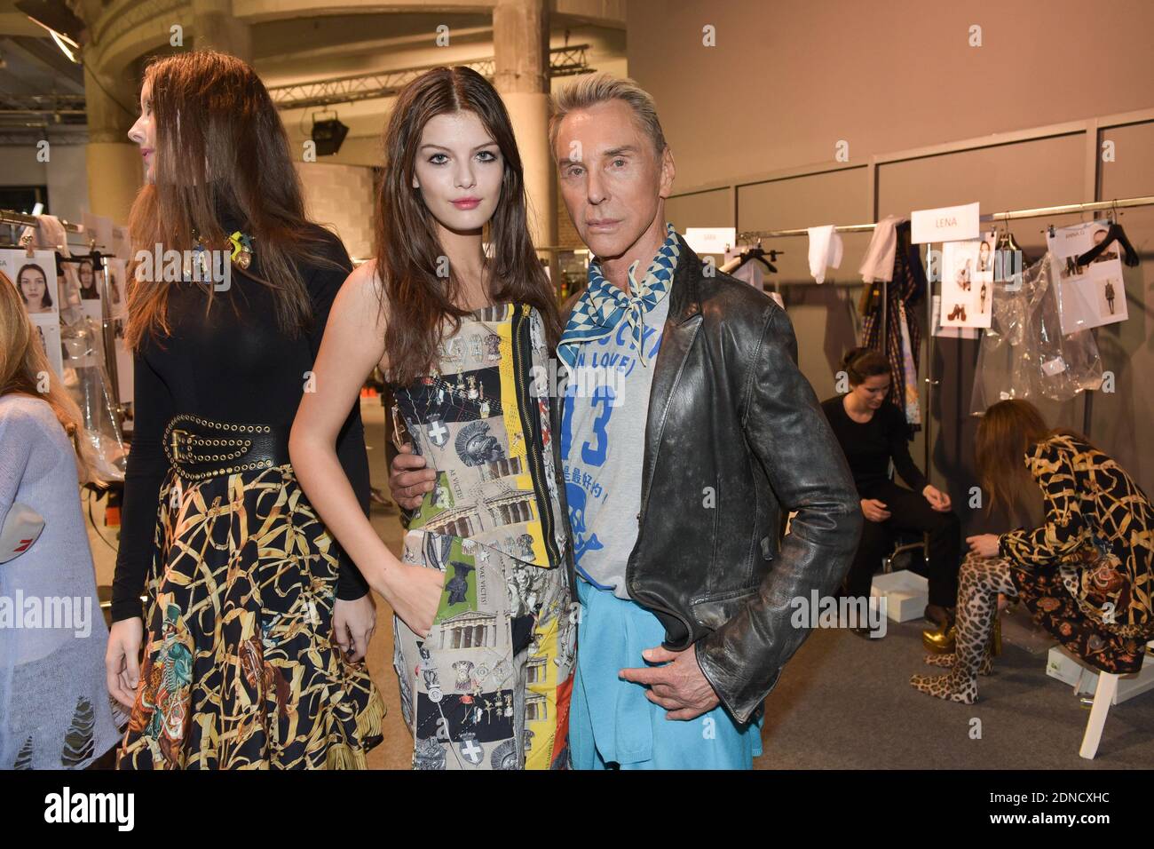 German designer Wolfgang Joop poses with a model backstage ahead of  Wunderkind Fall/Winter 2015-2016 Ready-to-Wear collection show held at the  Palais de Tokyo in Paris, France, March 9, 2015. Photo by Laurent