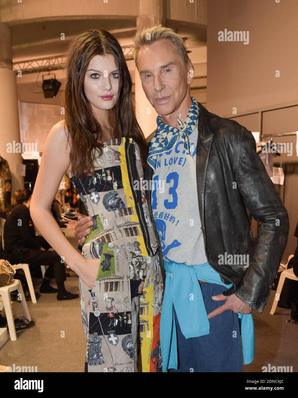 German designer Wolfgang Joop poses with a model backstage ahead of  Wunderkind Fall/Winter 2015-2016 Ready-to-Wear collection show held at the  Palais de Tokyo in Paris, France, March 9, 2015. Photo by Laurent
