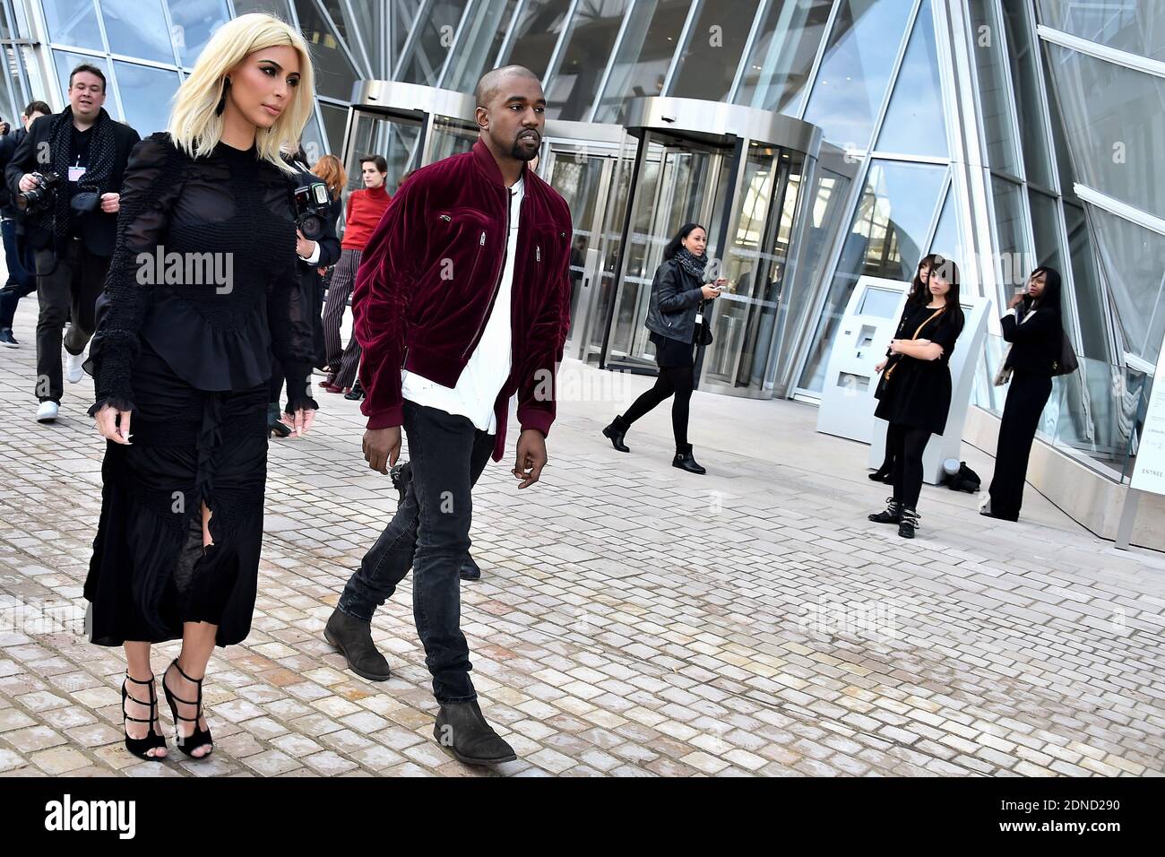 Kanye West and Kim Kardashian arrive to Louis Vuitton Fall/Winter