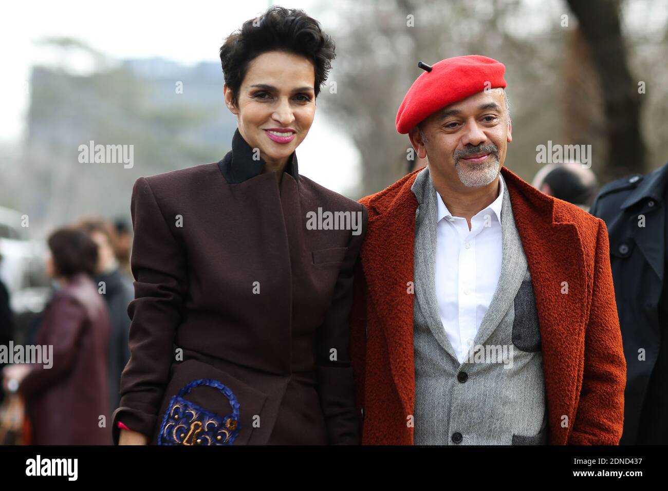 Farida Khelfa and Christian Louboutin arriving for the Louis Vuitton  Fall-Winter 2015/2016 Ready-To