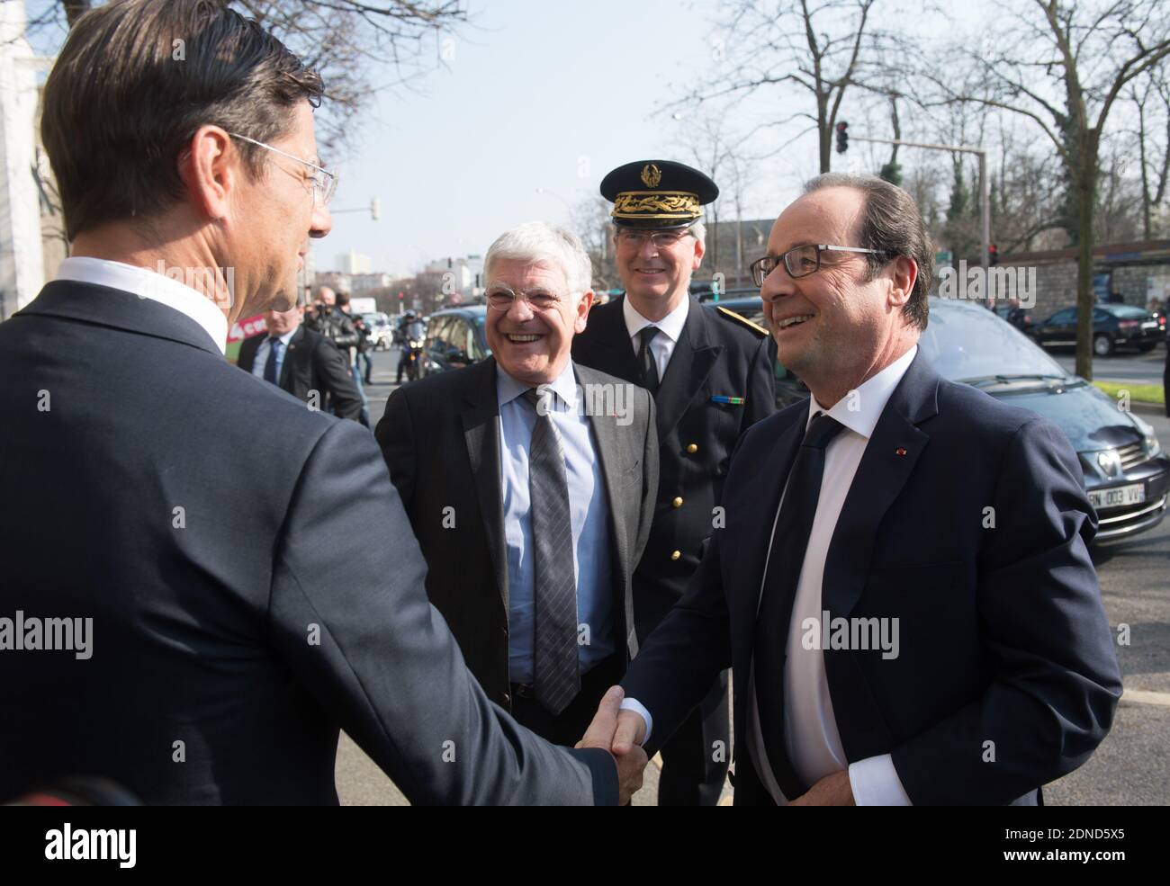 French President Francois Hollande (R) shakes hands with BPI director ...