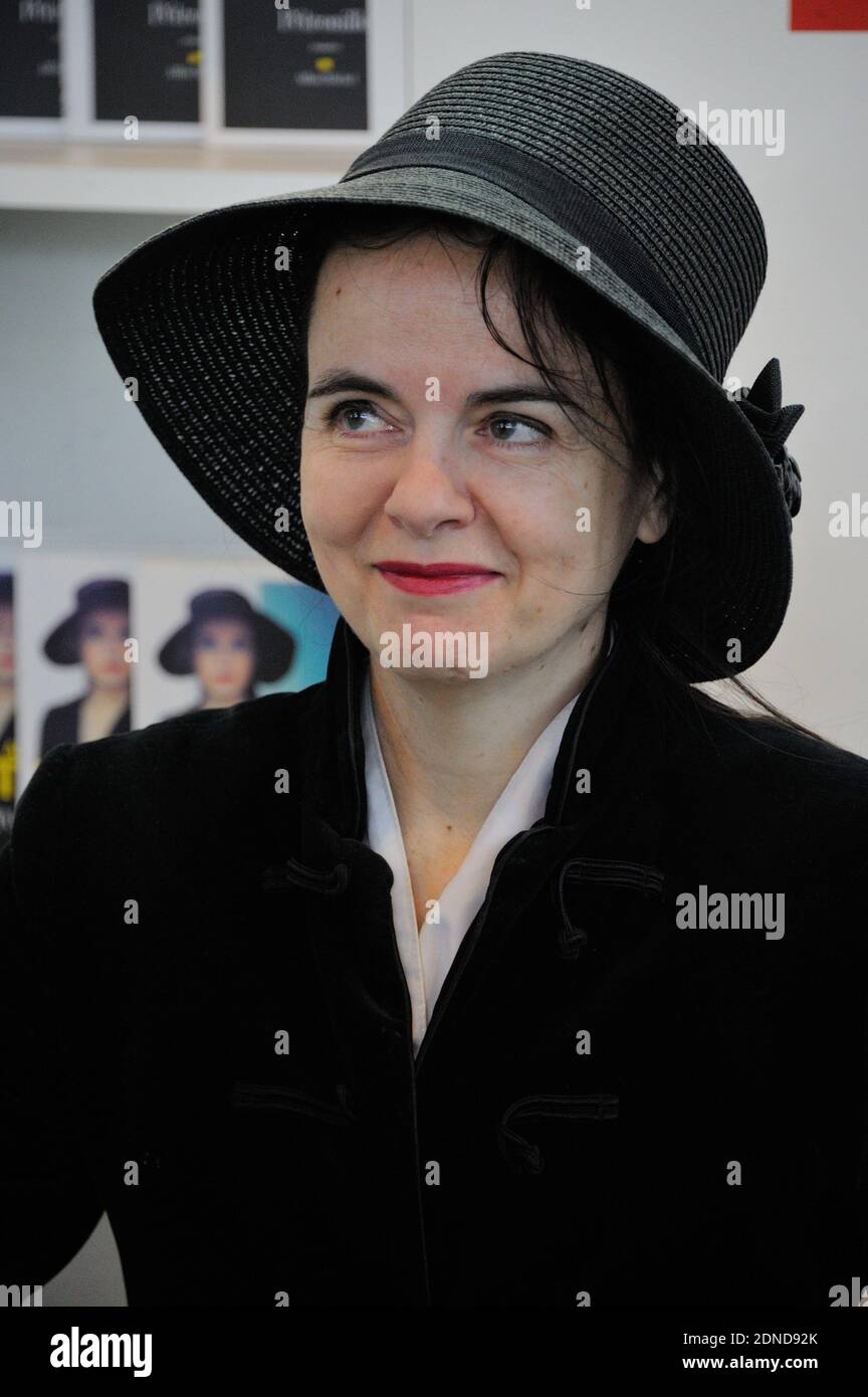 Amelie Nothomb signs copies of his book during the 35th Salon du Livre