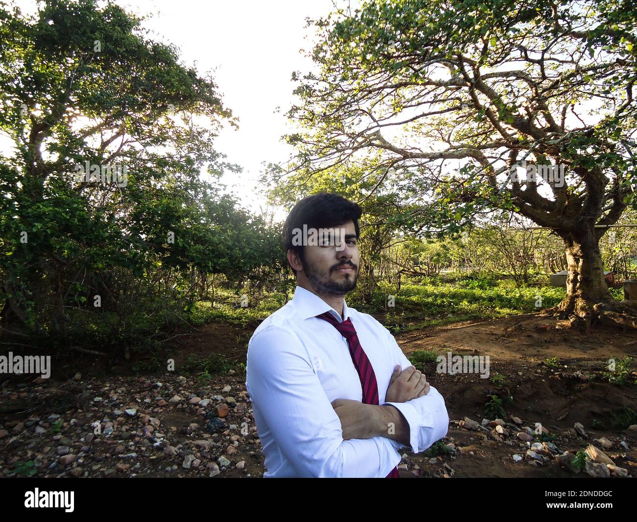 South indian man standing arms hi-res stock photography and images - Alamy