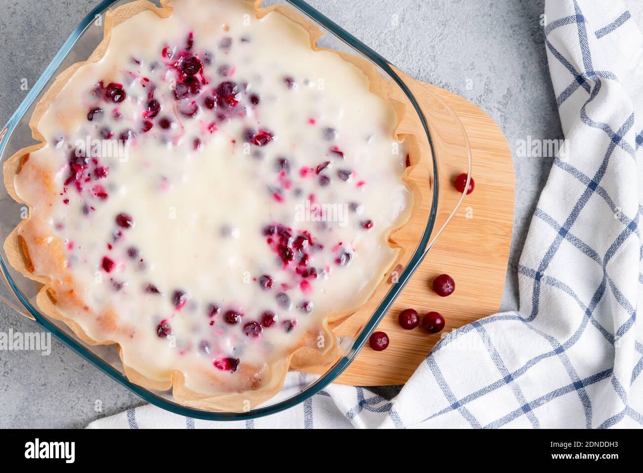 Homemade cranberry and sour cream pie in a glass baking dish. Top view Stock Photo