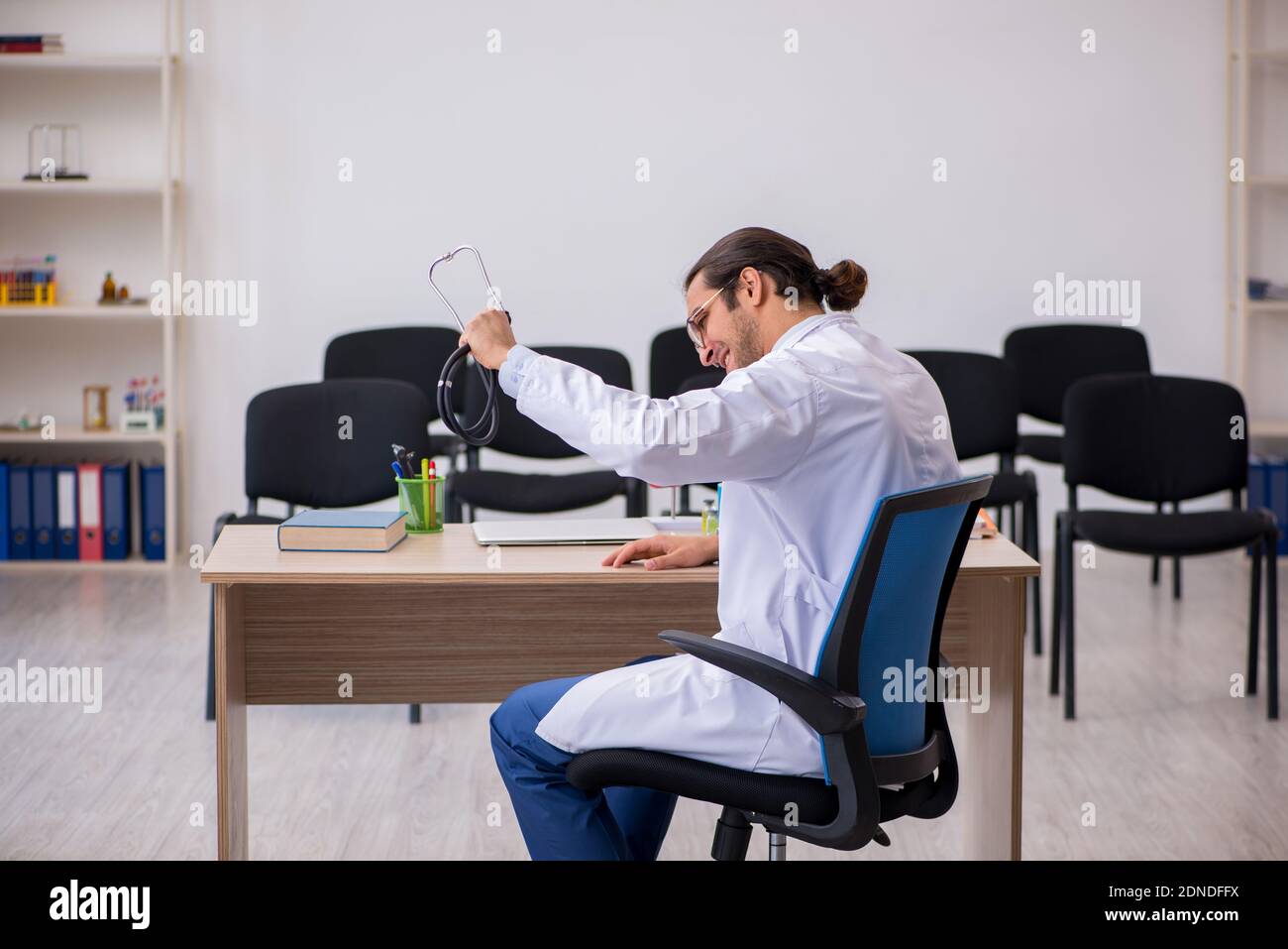 Stressed young man doctor giving hi-res stock photography and images ...