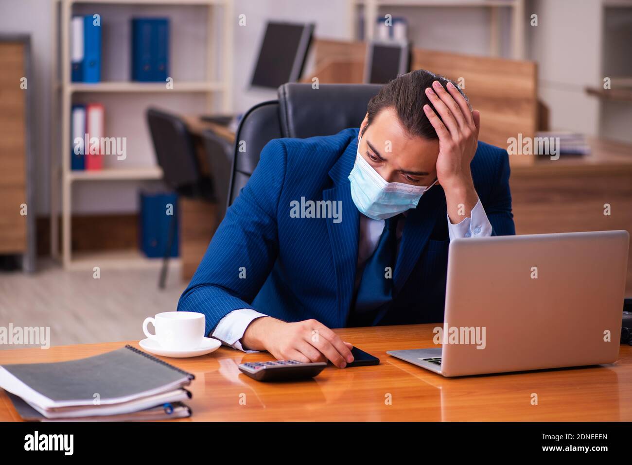Overworked employee wearing covid hi-res stock photography and images ...