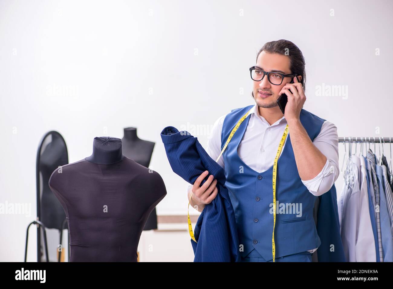 Young tailor working at workshop Stock Photo