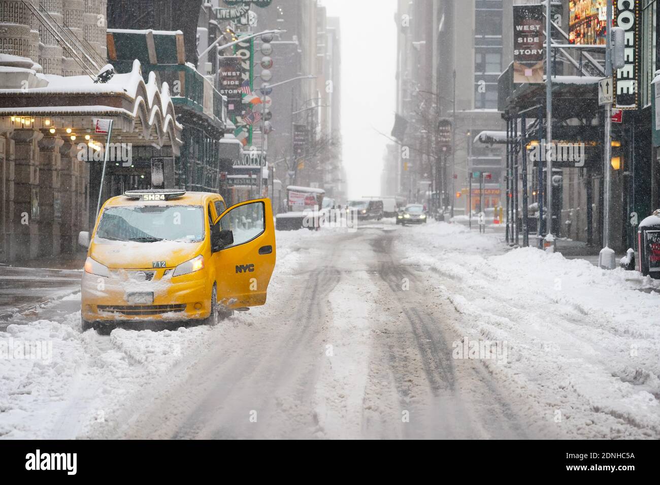 A view of a snow-covered NYC yellow cab during a winter storm.The morning  after a powerful winter storm hit the US northeastern states, a major  snowstorm hit the US east coast during