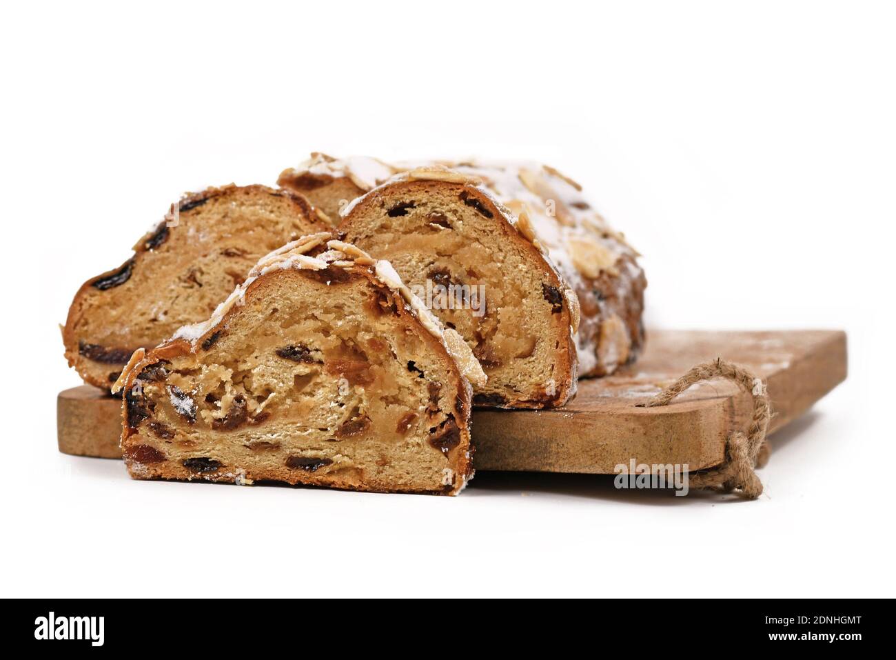 German Stollen cake, a fruit bread with nuts, spices, and dried or candied fruits with powdered sugar traditionally served during Christmas time Stock Photo