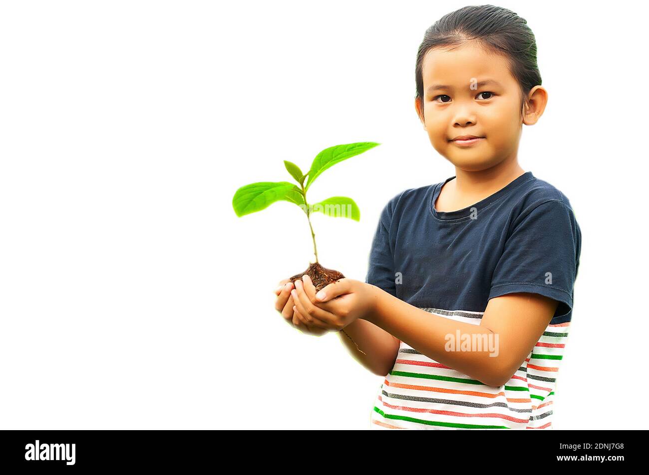 Indian girl holding plant Cut Out Stock Images & Pictures - Alamy