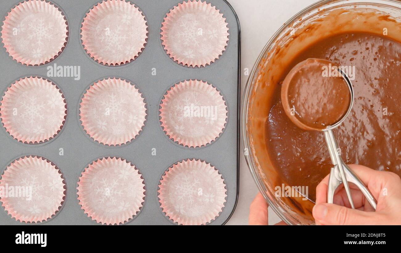 Chocolate muffins recipe. Pouring chocolate batter into lined cupcake