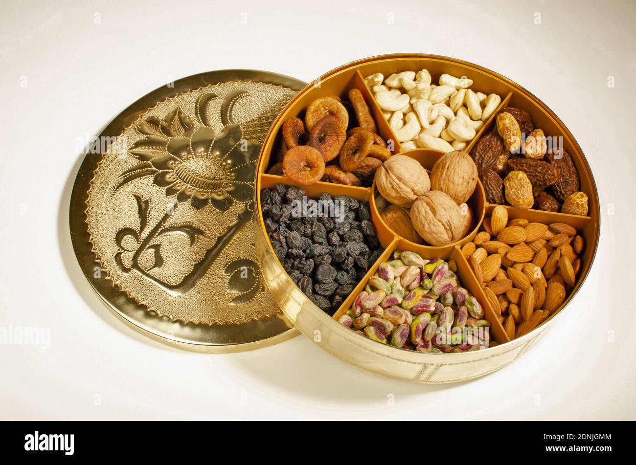 Dried Fruit Almonds, Green Pistachio, Walnut with Shell, dried Fig and Cashew nuts in container Top angle. Studio Shot Stock Photo
