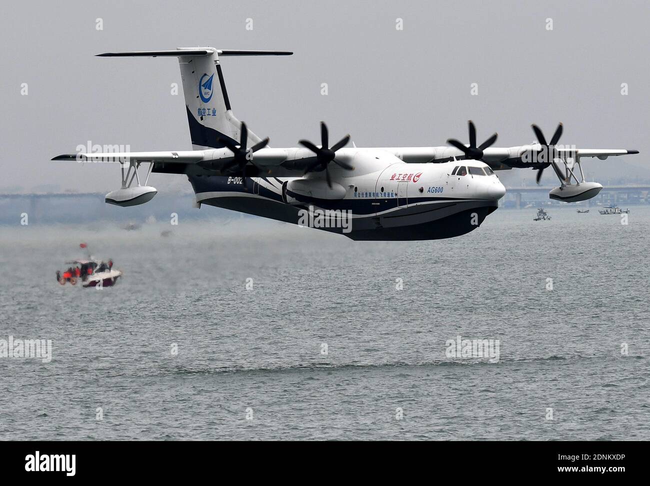 Beijing, China's Shandong Province. 26th July, 2020. An AG600 'Kunlong' amphibious aircraft flies over the sea off Qingdao, east China's Shandong Province, July 26, 2020. China's indigenously developed AG600 large amphibious aircraft succeeded in its maiden flight over sea in Qingdao. Credit: Li Ziheng/Xinhua/Alamy Live News Stock Photo