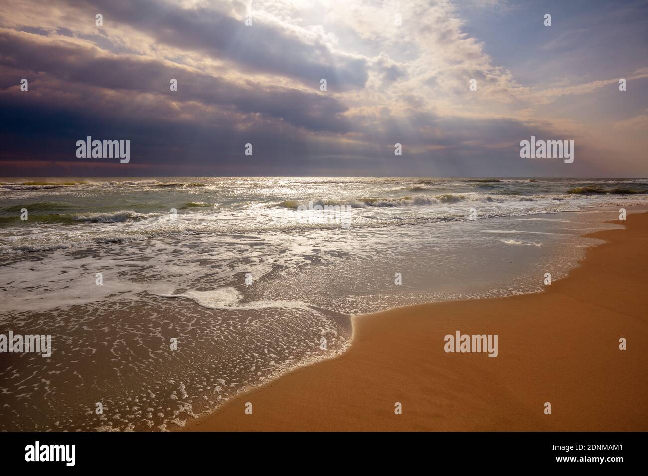 Seascape. Seashore with dramatic sky. Landscape with ocean and bright evening cloudy sky Stock Photo